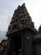A_close-up_view_of_the_Gopuram_above_the_main_entrance_of_the_Sri_Mariamman_Temple.jpg