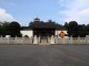 The_main_entrance_to_the_Bonsai_Garden_guarded_by_a_pair_of_stone_lions.jpg