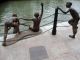The_First_Generation_sculpture_by_the_Singapore_River_depicting_the_life_as_it_was.jpg