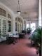 The_veranda_of_the_Raffles_Hotel_Arcade_is_very_much_of_the_British_Colonial_style.jpg