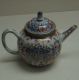 A_blue-and-white_teapot_with_enamel_decoration_added_in_Holland_from_the_Qing_Dynasty_circa_1710-1730.jpg
