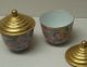 A_pair_of_covered_cups_with_mille-fleur_design_and_gilt_covers_from_the_Qing_Dynasty_in_the_reign_of_Jiaqing_2.jpg