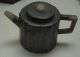A_teapot_encased_in_pewter_in_flower_shape_from_the_Qing_Dynasty_in_the_reign_of_Daoguang_2.jpg