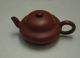 _Mengchen_teapot_of_a_compressed_round_shape_from_the_Qing_Dynasty_during_the_18th_century.jpg