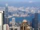 A_telephoto_shot_towards_Tsim_Sha_Tsui_and_beyond_from_The_Peak_on_a_clear_day.jpg