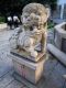 The_male_guard_lion_with_globe_on_the_right-hand_side_of_Tin_Hau_Temple.jpg