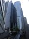 Walking_up_to_the_Citibank_Tower_whos_exterior_reflects_the_Bank_of_China_building.jpg