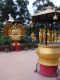 Incense_burner_vessel_and_various_Bodhisattvas_on_the_lower_level_of_The_Ten_Thousand_Buddhas_Monastery.jpg