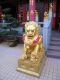 The_female_guard_lion_with_cub_on_the_right-hand_side_of_the_main_temple_at_The_Ten_Thousand_Buddhas_Monastery.jpg