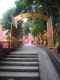 There_is_still_some_way_along_the_path_to_the_main_part_of_The_Ten_Thousand_Buddhas_Monastery.jpg